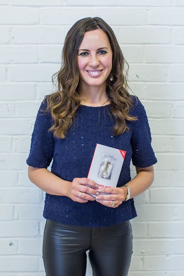 Picture of Gail holding copy of book 'Secrets and Confessions'