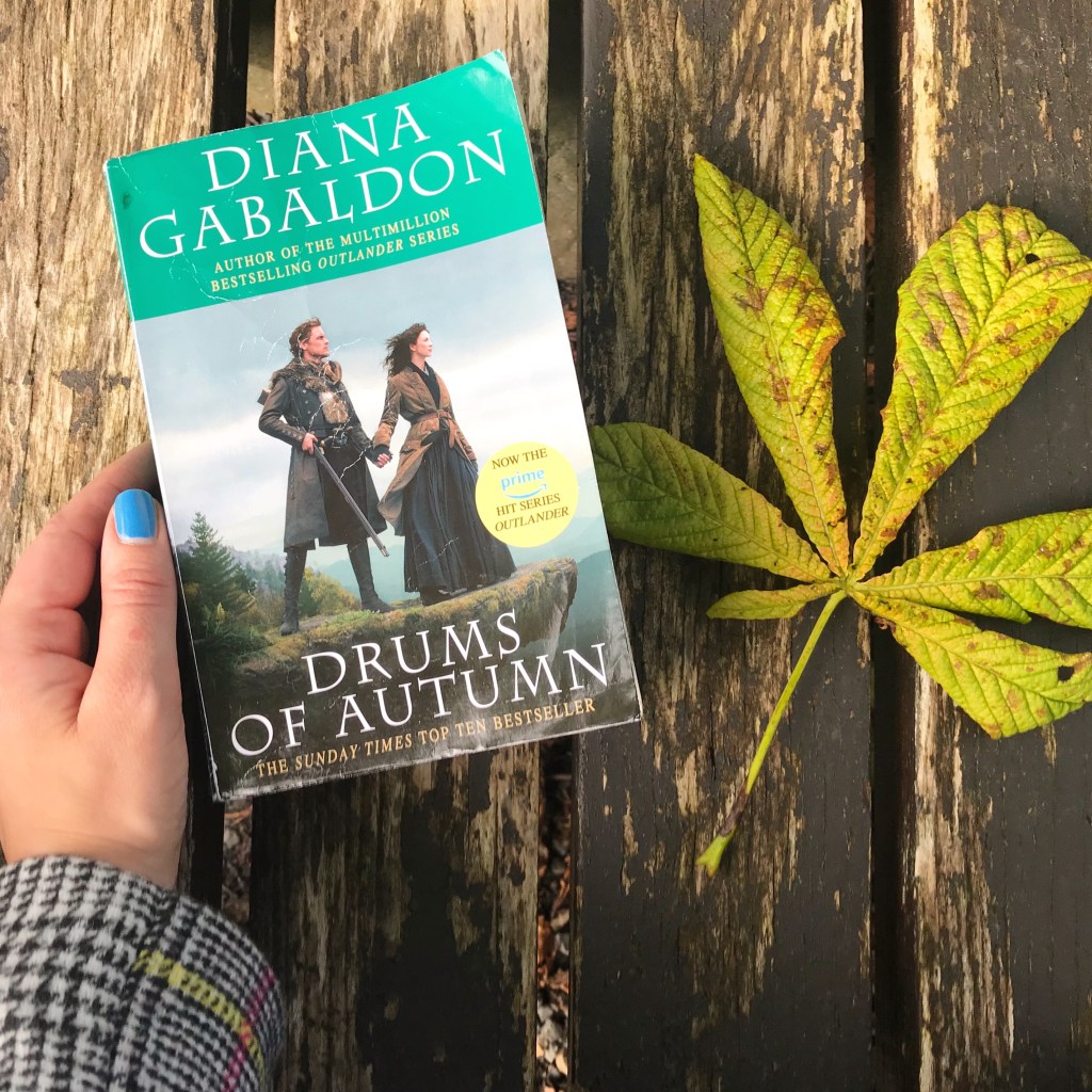 Drums of Autumn book on bench