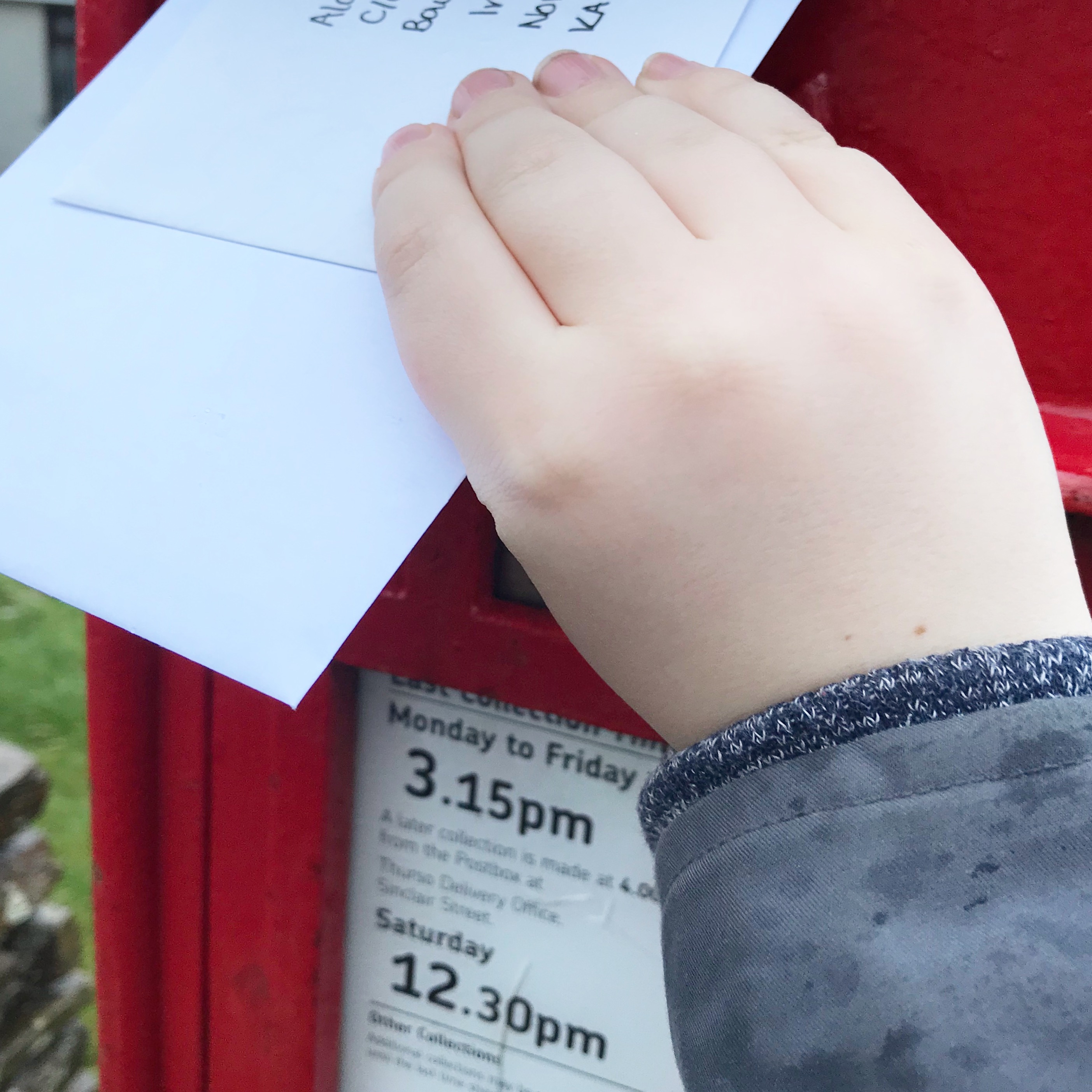 Picture of child posting letter