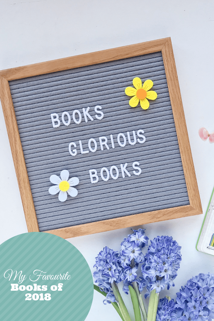 'Books Glorious Books' written on letterboard with flowers