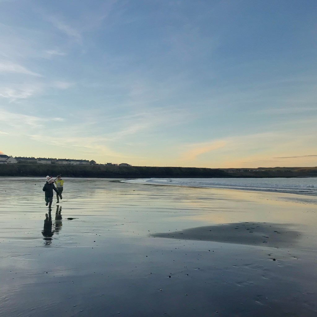 Beach Scene with boys running