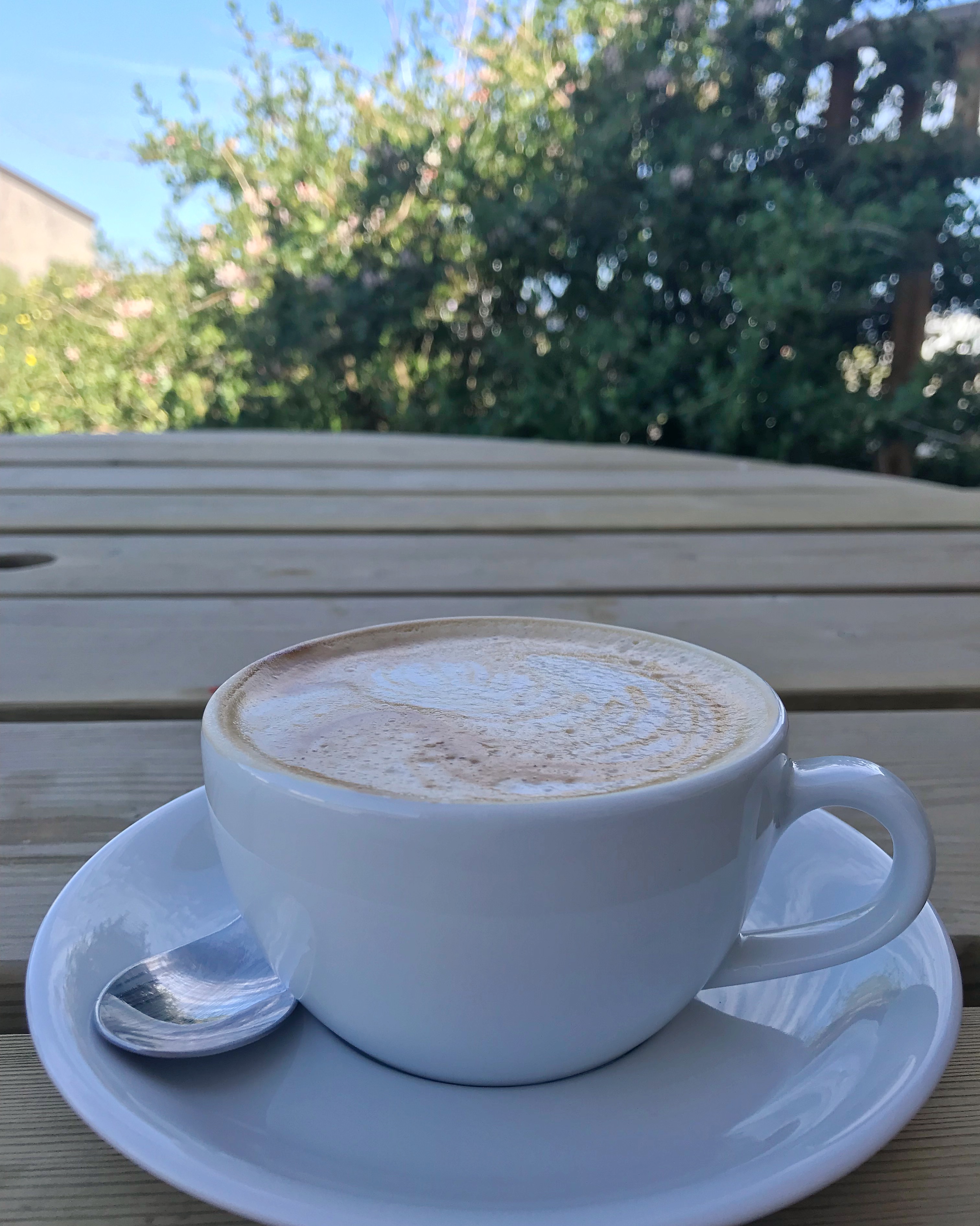 Coffee on table outside at Blue Door Diner, Caithness