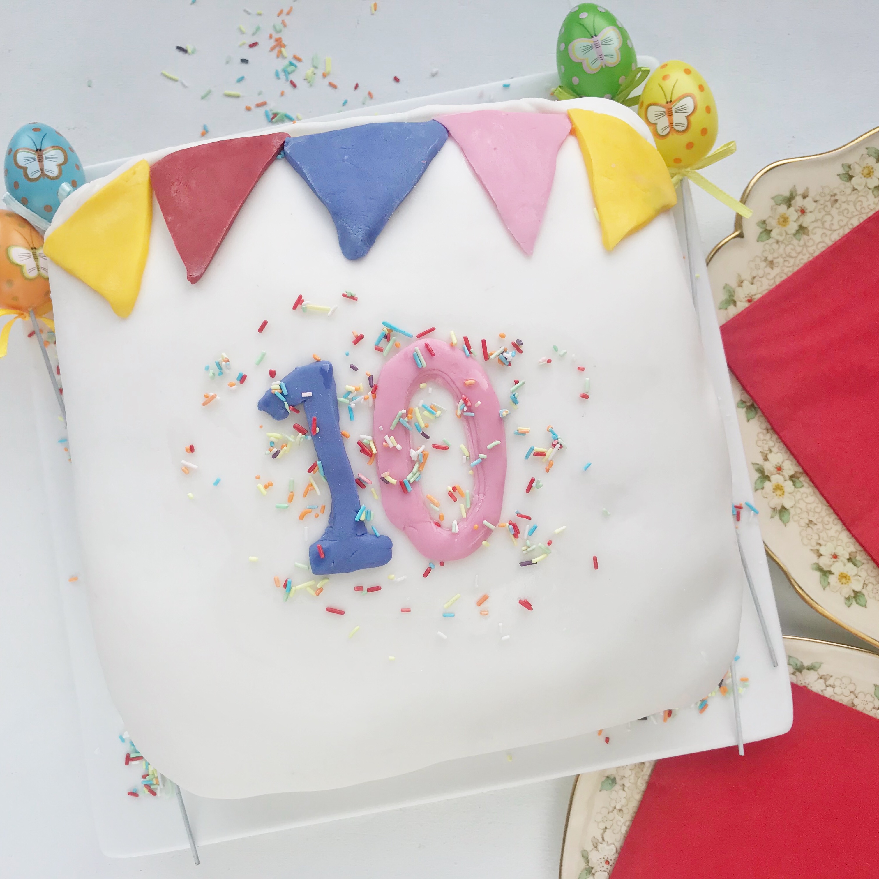 Birthday Cake with '10', bunting decoration and sprinkles