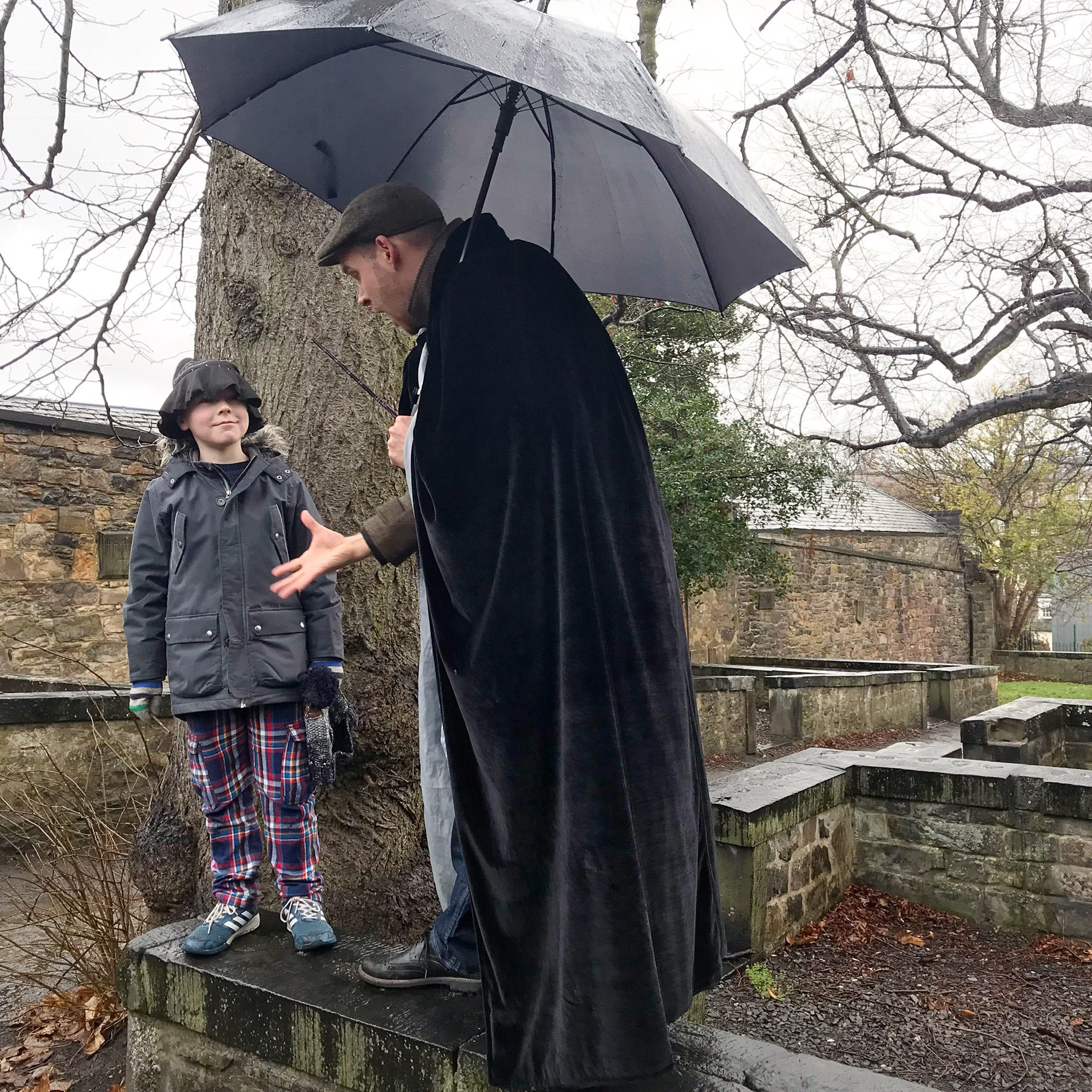 Picture of boy getting sorted into a wizarding house on the Potter Trail