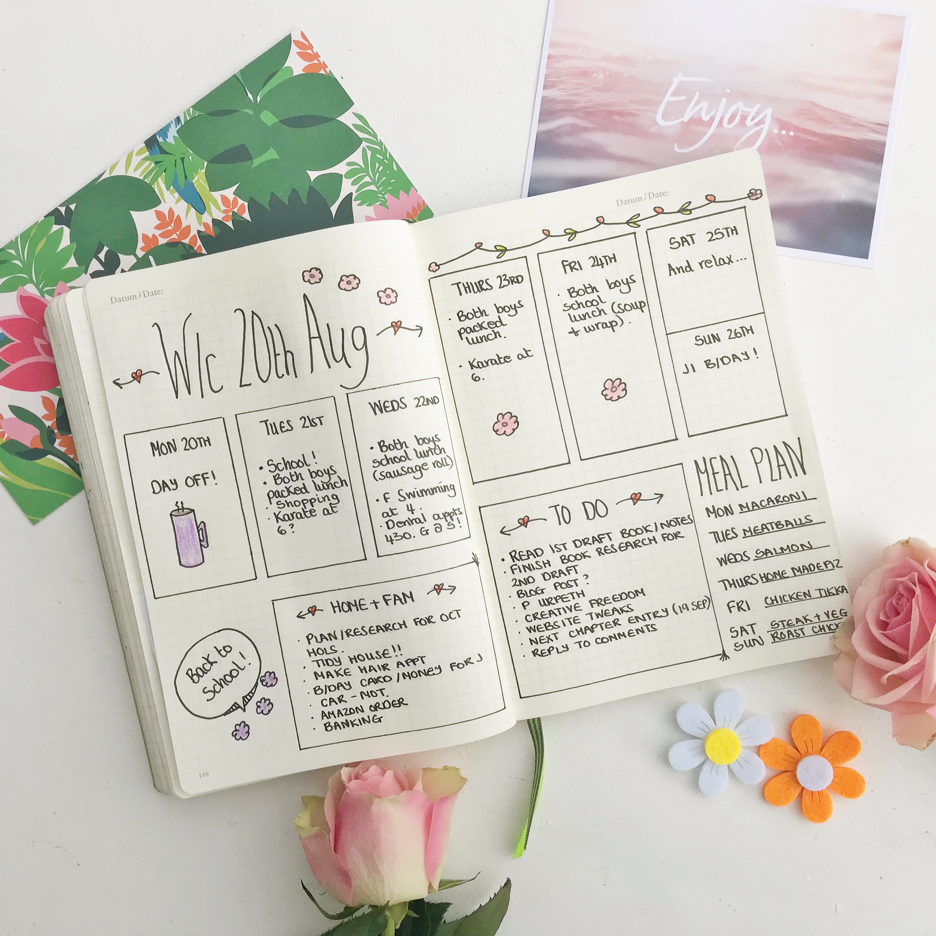 Flatlay picture of bullet journal with weekly spread