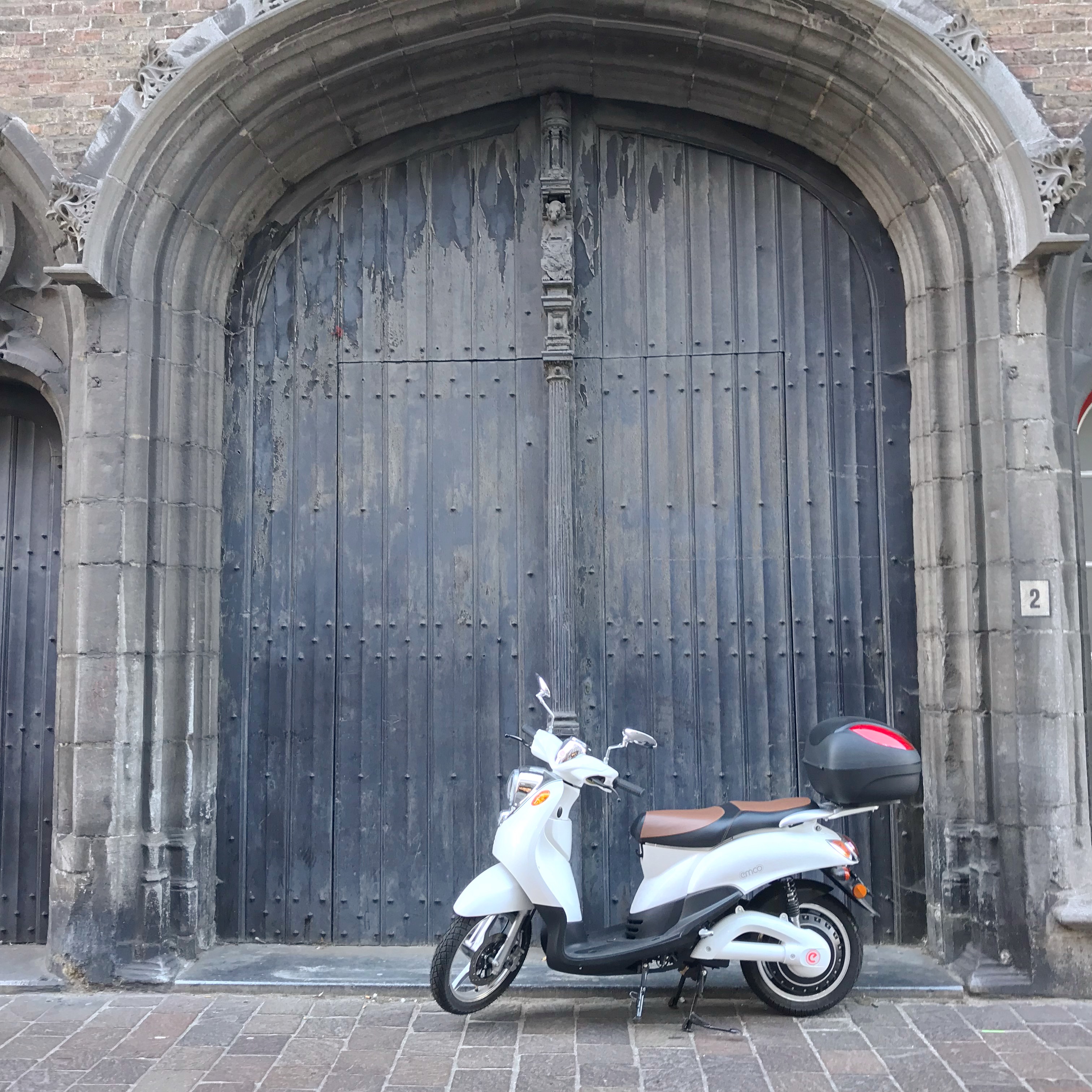 Parked Moped against door, Bruges
